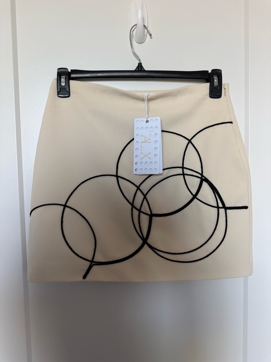 AX Paris Dresses & Skirts - AX Paris Cream Mini Skirt with Black Circle Motif